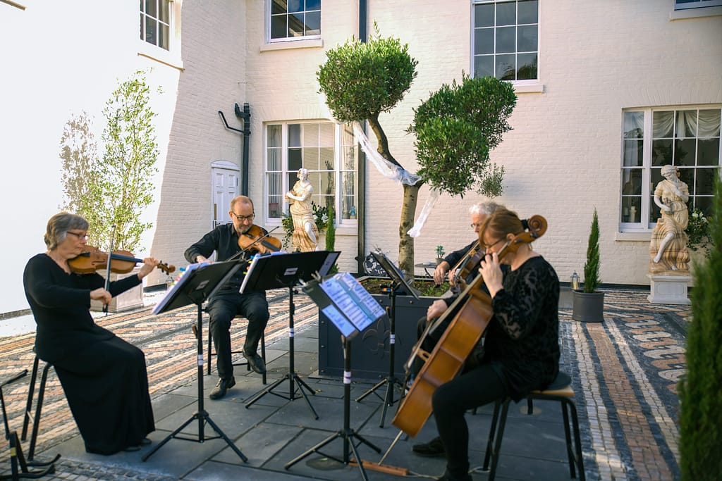 string quartet playing at aternoon reception