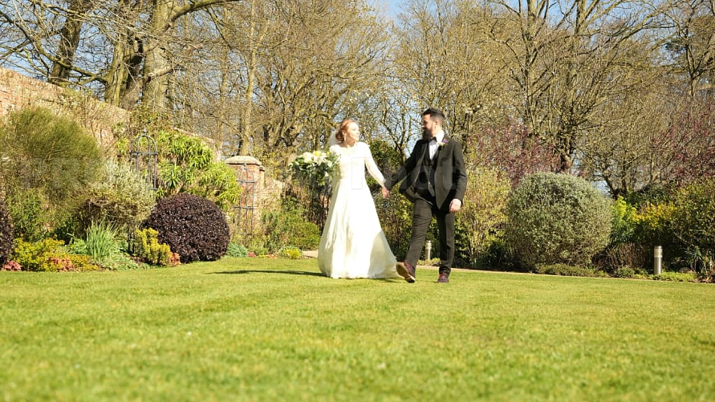 groom bride walk grass